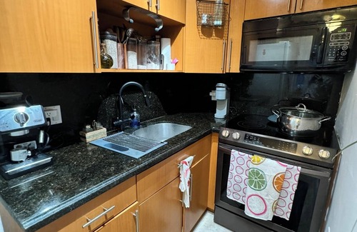 North Miami Condo | Waterfront Condo with Fishing, Paddleboard, and yard access.