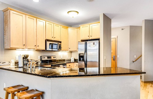 Three Lakes Condo | Waterfront condo with loft, washer/dryer, fireplace, balcony, pools, & hot tubs