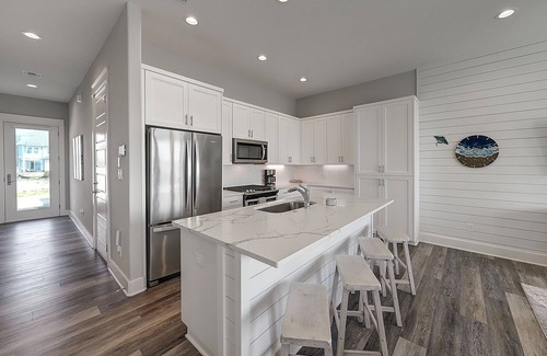 Rockport House | Waterfront haven with Bay views, patio, luxe suites, and shared dock and pool