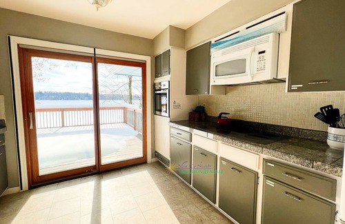 Interlochen House | Waterfront home near Interlochen. Fireplaces.