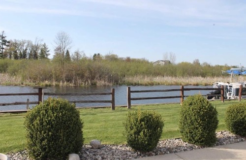 Houghton Lake House | Waterfront Home with Dock, Boat Launch, and Movie Theatre Room!