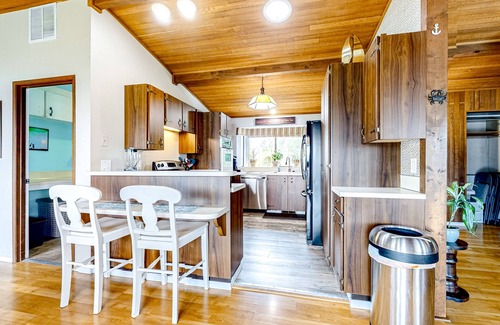 Erlands Point-Kitsap Lake House | Waterfront home with beach access, firepit, fireplace, water views, grill, dock