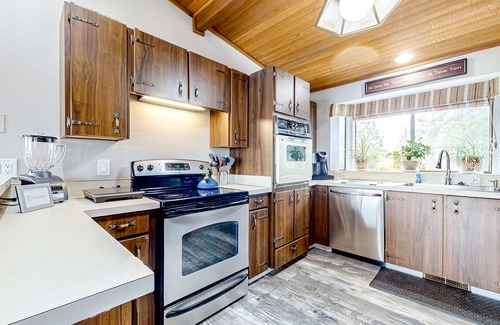 Erlands Point-Kitsap Lake House | Waterfront home with beach access, firepit, fireplace, water views, grill, dock
