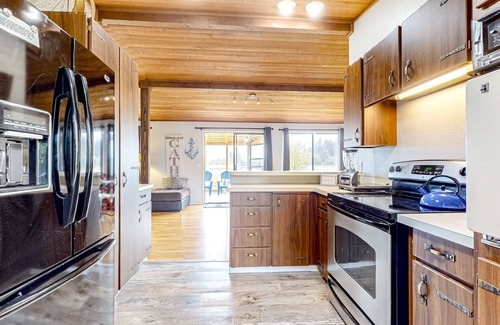 Erlands Point-Kitsap Lake House | Waterfront home with beach access, firepit, fireplace, water views, grill, dock