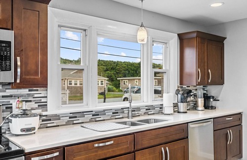 Fairhaven House | Waterfront Oasis with day beds and hot tub with captivating sunsets.