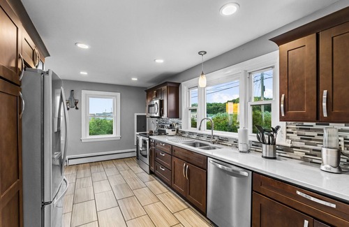 Fairhaven House | Waterfront Oasis with day beds and hot tub with captivating sunsets.