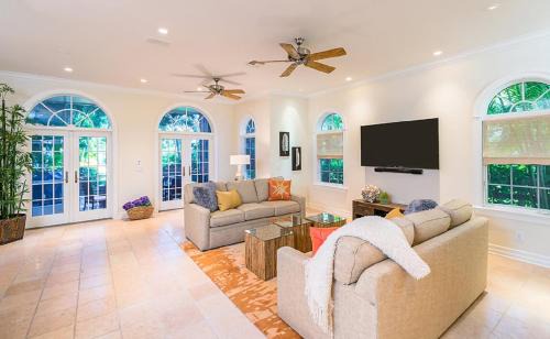Captiva House | Waterfront Pink House with Private Dock & Pool