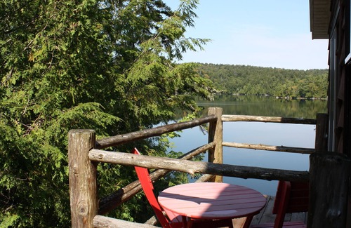 Saranac Lake Apartment | Waterfront Suite with Deep Soaking Tub, Balcony, water views