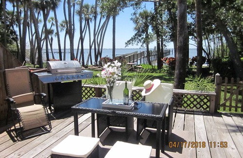 Port Canaveral House | Waterfront Sunsets overlooking a serene garden and a private pier
