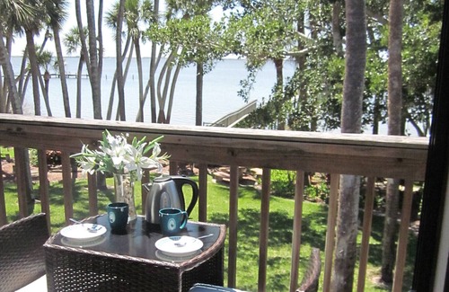 Port Canaveral House | Waterfront Sunsets overlooking a serene garden and a private pier