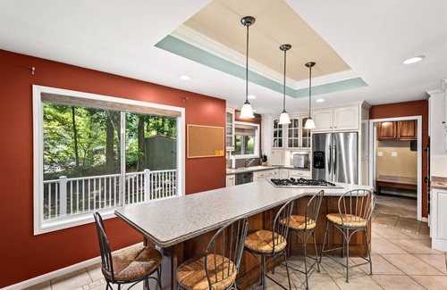 Livingston House | Waterfront w/room to gather & beautiful lake views! Lakeside firepit w/swings
