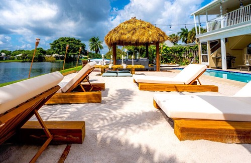 Florida North Atlantic Coast Villa | Waterfront w/Beach Htd Pool Cinema Game Room Tiki