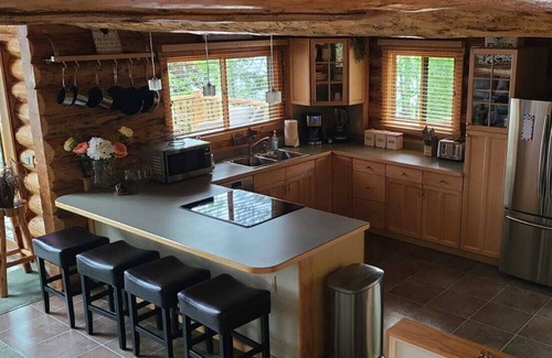 Kalispell House | Waterfront w/ Water Slide, Rock Climbing Wall & Ice Fishing Shanty in Winter