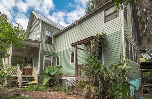 Crescent City House | West Stella Lake House with Outdoor Pool Table & Fireplace by RedAwning