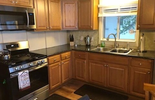 Kalkaska Cabin | Wheeler Lake House:Summer at Wheeler Lake – Kayaks, Swimming & Pure Relaxation!