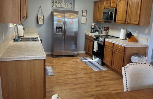 Shoreline Park House | Wine’d Down-Charming 2 BR/2BA on the water with a pool & dock in Bay St Louis
