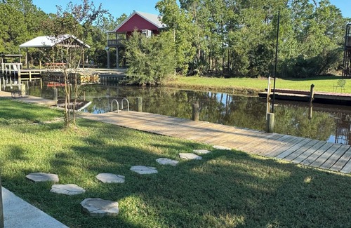 Shoreline Park House | Wine’d Down-Charming 2 BR/2BA on the water with a pool & dock in Bay St Louis
