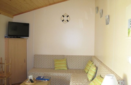 Saint-Pierre-d'Oleron Ski Chalet | wooden chalet in the gardens of St Pierre