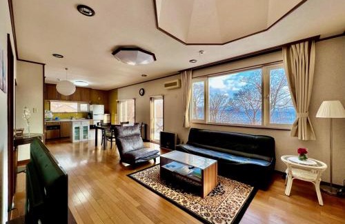 Toyako House | Yellow House by Lake TOYA