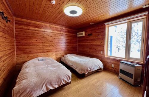 Toyako House | Yellow House by Lake TOYA