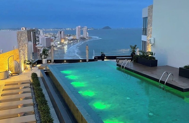 2-bedroom condo in serene Mazatlán with AC, fitness room. Live it up
