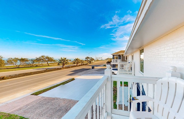 2nd-floor condo with water view, updated interior, private balcony, & W/D