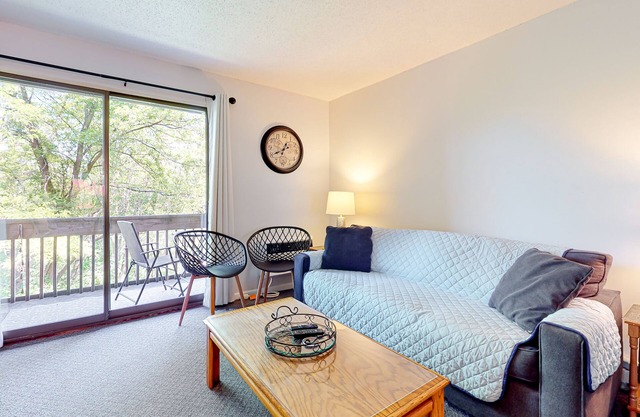 2nd-Floor condo with a private balcony, on-site beach, outdoor pool, laundry