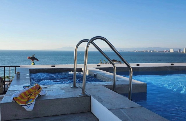 360 Rooftop Views, Charming, Modern, Quiet and steps to Shops and Entertainment!