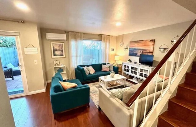 3BR/3BA Coastal themed Townhome w/Private parking! Centrally located! Patio/BBQ