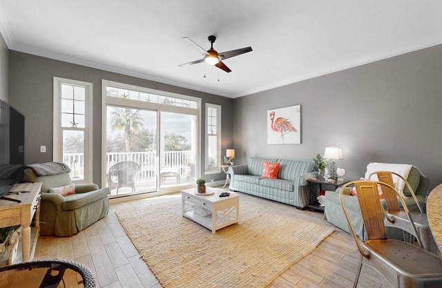 3rd-floor beach view condo with resort amenities, private balcony, W/D, & AC