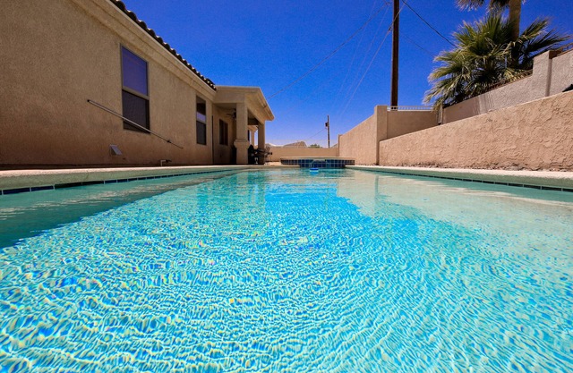 4 Bedroom with a pool and spa . Rv and boat parking . Close to launch ramp.