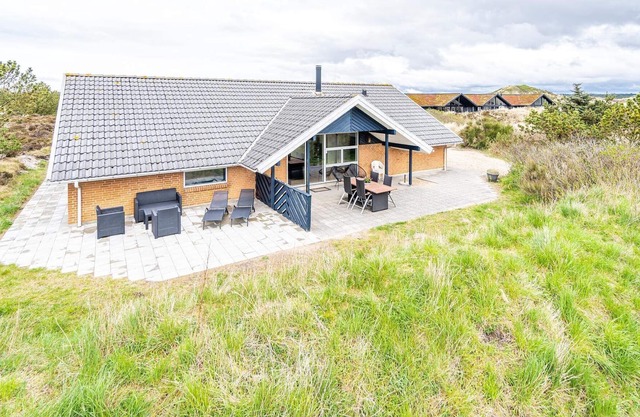 8 person holiday home on a holiday park in Henne