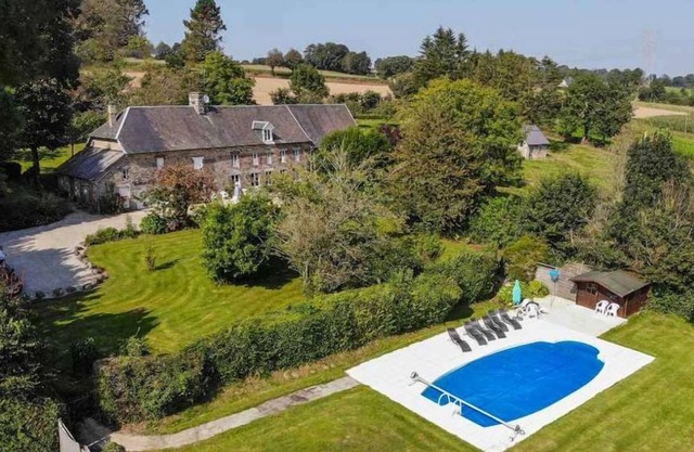 A stunning holiday house in Nomandy with large garden and heated pool.