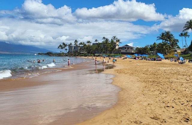 Across from Kamaole 2 Beach, concrete building, well maintained.