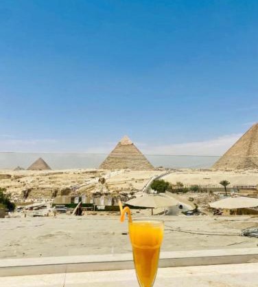 AL NABELLA SCARAB pyramids view