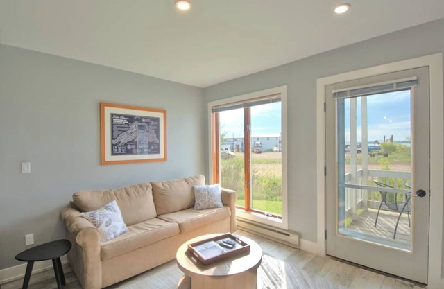 All-New Condo Steps from the Beach