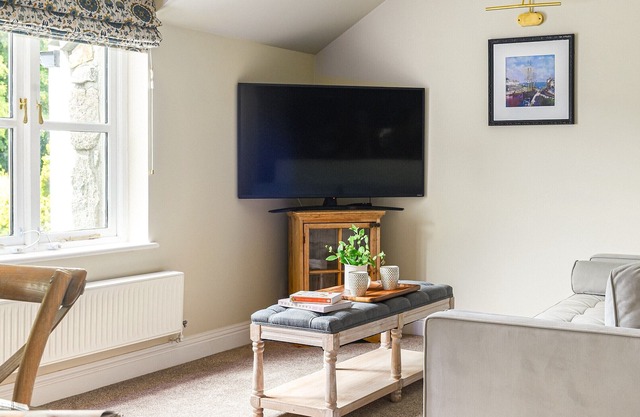 An exceptional two-bedroom coach house with games room and gardens, set in a quiet tucked away locat
