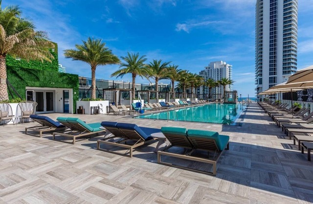 Bay views, luxury finishes, and coastal chic in this 1-bedroom heaven