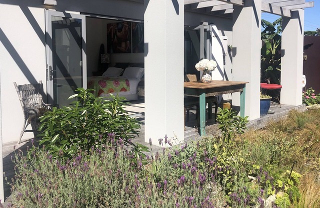 Beach studio with gardens.