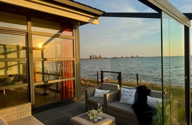 Beachfront Chalet with Fenced Garden and Exceptional Sea Views in Enkhuizen