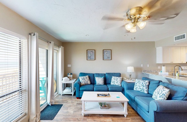Beachfront East End townhouse with beach views, deck, on-site pool & grills