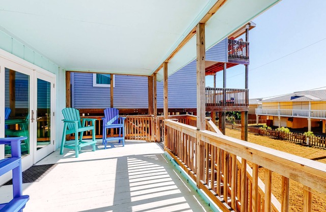 Beachfront home with central A/C, ocean views, deck, balcony, & beach access