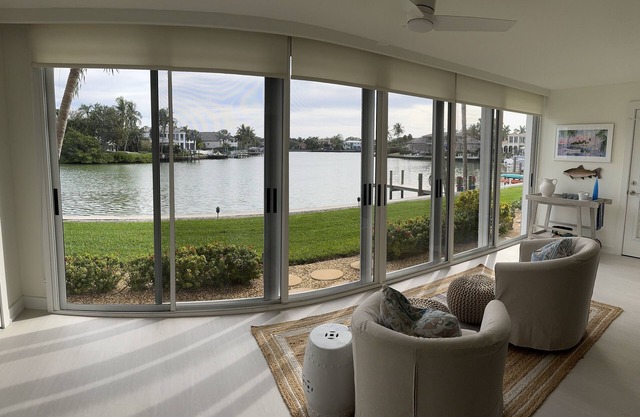 Beautiful bayfront condo in paradise directly across from beach with boat dock