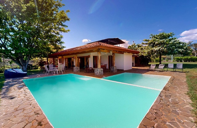 Beautiful farmhouse on a large lot with mountain views & a private pool