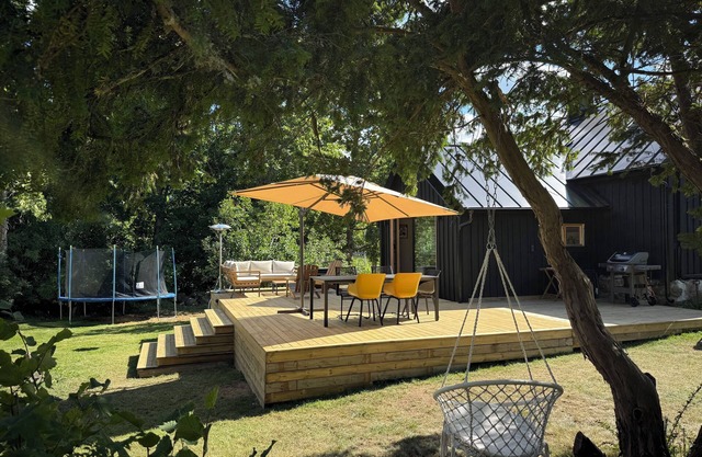 Black wooden house in the forests of southern Sweden