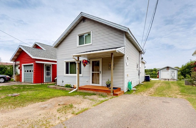 Boom Lake Living | House in Rhinelander with a dock, firepit, & alfresco dining