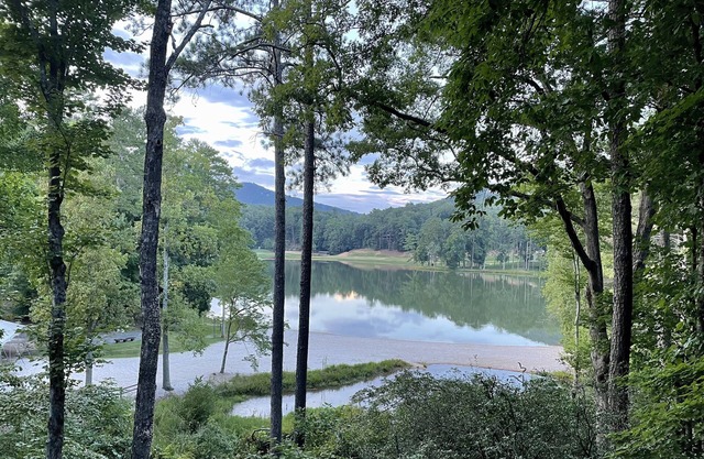 Breathtaking lake views, steps from beach, golf, and clubhouse. Renovated home!