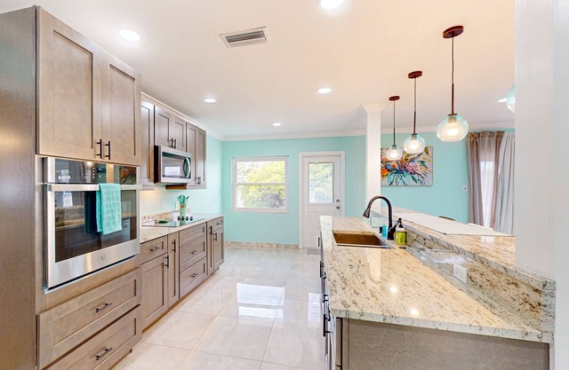 Brick beauty with private yard, BBQ, patio, AC, & W/D