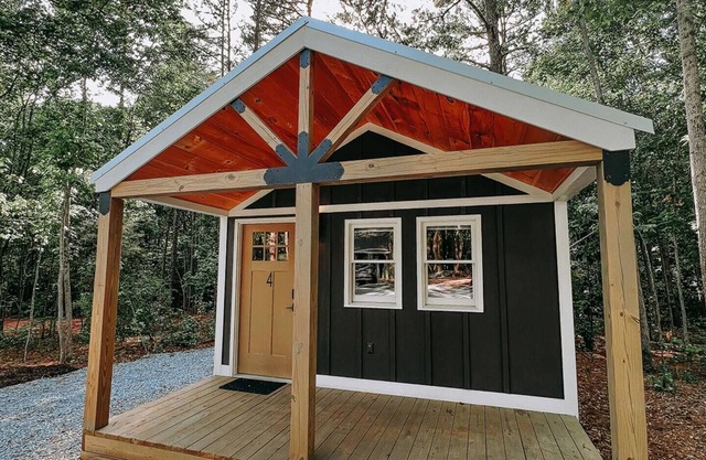 Cabin #4: Two queen-size beds with a kitchenette and a large gravel parking pad beside the cabin for easy boat or trailer storage.