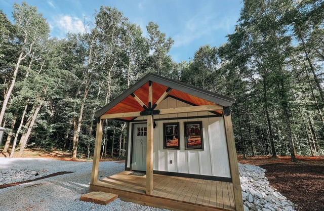 Cabin #9: One king-size bed, a kitchenette, and a large gravel parking pad beside the cabin for easy boat or trailer storage.